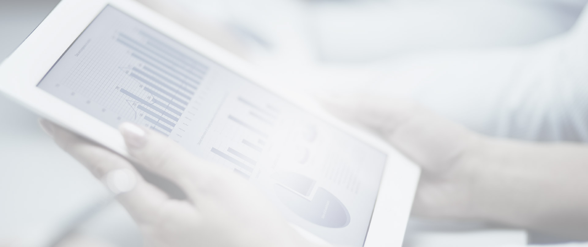 A close up of a tablet with graphs on it